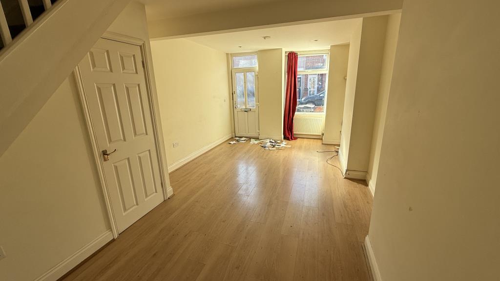 Lot: 133 - VACANT END-TERRACE HOUSE - Inside image of living room